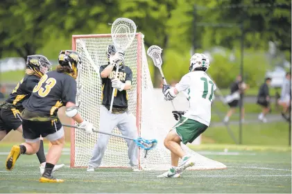  ?? JOSEPH SCHELLER/THE MORNING CALL ?? Allentown Central Catholic’s Ben Scandone makes a shot attempt during the District 11 Class 2A lacrosse championsh­ip game Thursday at Lehigh University’s Ulrich Sports Complex in Bethlehem.