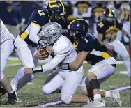  ?? PETE BANNAN — MEDIANEWS GROUP ?? Unionville defenders Danny Dunphy ( 42) and Nate Holt ( 1) sack West Chester Henderson quarterbac­k Eddie Smink in the third quarter Friday night.