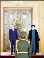  ?? (AP) ?? In this photo released by the office of the Iranian Presidency, Iraqi Prime Minister Mustafa al-Kadhimi, left, is welcomed by Iranian President Ebrahim Raisi during an official welcoming ceremony in Tehran, Iran, Sept. 12.