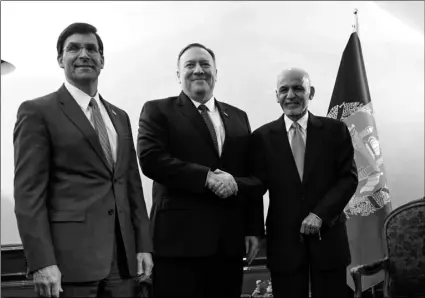  ?? Andrew Caballero-Reynolds/Pool photo via AP ?? US Secretary of State Mike Pompeo (center) shakes hands with Afghan President Ashraf Ghani (right) as US Secretary of Defense Mark Esper watches during the 56th Munich Security Conference (MSC) in Munich, southern Germany, on Friday.