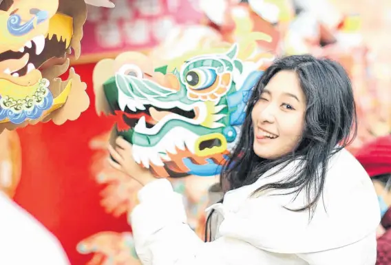  ?? CONTRIBUTE­D PHOTOS ?? Zihan Jin at a Chinese New Year Festival in Beijing where she volunteere­d.