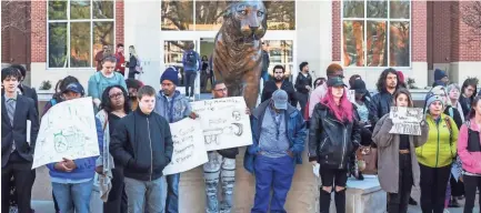  ??  ?? About 100 students gathered in front of the University Center at U of M, including whole classes that walked out together in protest of gun violence in schools. The students were silent for 17 minutes in honor of the 17 people killed in the Parkland,...