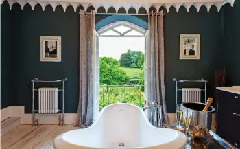  ??  ?? GOTHIC SPLENDOUR:
Thornemead Castle in Somerset, top left. Top: The living area at Bodney Lodge in Norfolk. Above: The view from the slipper bath at Colleton Hall, Devon