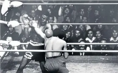  ??  ?? Peter ‘Terror’ Mathebula, left, seen here fighting with Tae Shik Kim of Korea in 1980 in LA, will be honoured with an internatio­nal tournament on Sunday. / Supplied