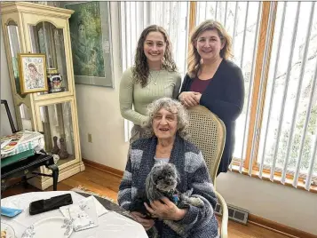  ?? MARY ANN THOMAS/PITTSBURGH POST-GAZETTE/TNS ?? Ethel Bonder sits as her granddaugh­ter, Zoe Spodek (left), and her daughter, Kara Spodek, stand behind her. Bonder was born Feb. 29, 1932, and will technicall­y turn 23 Thursday. “I was angry because I didn’t have a birthday when I was a kid,” she said. “I told them I wasn’t born in March.”