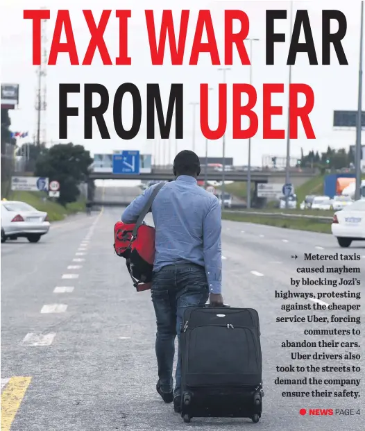  ?? Picture: Neil McCartney ?? TREK. One of two men who were due to fly to DR Congo yesterday and had to leave their car, is seen walking to the airport during a protest by metered taxi drivers against the Uber cab app on the R24 near the Barbara Road off-ramp in Edenvale.