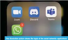 ??  ?? This illustrati­on picture shows the logos of the social networks applicatio­ns Zoom, Discord, Teams and WhatsApp on the screen of a phone.