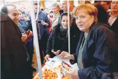  ?? — Reuters ?? Angela Merkel meets her supporters as she campaigns in Barth.