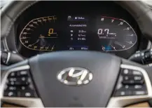  ??  ?? Top: Digital dials are too fussy and the tacho readout swings anti-clockwise. Facing page: The back seat isn’t the Verna’s forte; seat coolers are great for the Indian heat; ESP is standard with the automatic