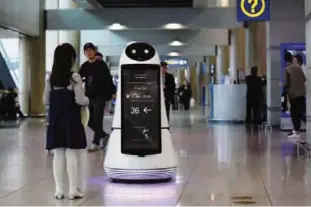  ??  ?? INCHEON: In this photo, Troika, a self-driving robot made by LG Electronic­s, moves around for visitors at the Incheon Internatio­nal Airport in Incheon, South Korea. —AP photos