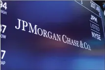  ??  ?? The logo for JPMorgan Chase & Co. appears above a trading post on the floor of the New York Stock Exchange in New York.