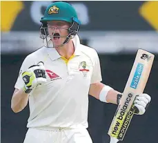  ?? — Reuters ?? Australia’s captain Steve Smith celebrates after reaching his century during the third day of the first Ashes cricket test match.