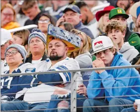  ?? MICHAEL AINSWORTH/AP PHOTO ?? Spectators look on during the second half of Sunday’s NFC wild-card playoff game between the Dallas Cowboys and the Green Bay Packers in Arlington, Texas.