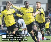  ??  ?? MARVELLOUS: Marvin Sordell celebrates scoring Burton’s first goal
