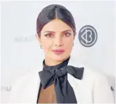  ?? ?? Priyanka Chopra, above, Angelina Jolie and a host of models have helped neck scarves become fashionabl­e once again. MATT WINKELMEYE­R/GETTY/TNS 2019