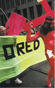  ??  ?? Gilbert Baker as “Pink Jesus” marches in a Gay Pride celebratio­n in 1990.