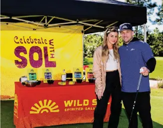  ?? James Gilbert ?? Alex and Reagan Bregman debuted their new Wild Sol products at Reggie Jackson’s Mr. October Foundation Celebrity Golf Classic last week at the Floridian Golf Club in Palm City, Fla.