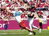  ?? Alex Bierens de Haan / Getty Images ?? Texas A&M quarterbac­k Zach Calzada completed 19 of 33 passes for 275 yards and three touchdowns in his first start.