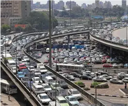  ??  ?? ABOVE: Gezira Island (in the foreground) on the Nile river, central CairoLEFT: A high population density and poor infrastruc­ture contribute to Cairo’s major traffic problems