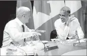  ?? AdrianWyld
Canadian Press ?? CANADIAN PrimeMinis­ter Stephen Harper jokes around with Obama at the dinner meeting.