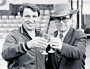  ??  ?? Champagne lifestyle: Elton John (right) with Graham Taylor during their glory years at Watford