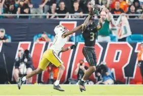  ?? AP PHOTO/WILFREDO LEE ?? Georgia Tech defensive back Kenan Johnson (10) breaks up a pass intended for Miami wide receiver Jacolby George (3) during Saturday’s game in Miami Gardens, Fla.