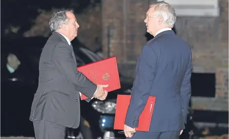  ?? Picture: Getty. ?? Internatio­nal Trade Secretary Liam Fox, left, and Brexit Secretary David Davis leave Downing Street after the Inner Brexit Cabinet meeting yesterday in London.