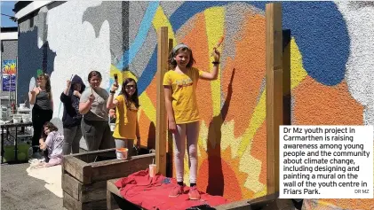  ?? DR MZ ?? Dr Mz youth project in Carmarthen is raising awareness among young people and the community about climate change, including designing and painting a mural on the wall of the youth centre in Friars Park.