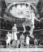  ?? By Andrew D. Bernstein, NBAE/GETTY Images ?? Up, up and away: Jeremy Lin shoots a reverse layup Friday in the Rising Stars Challenge.