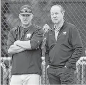  ?? Karen Warren / Houston Chronicle ?? Owner Jim Crane, right, takes in an Astros workout for the first time this spring with skipper A.J. Hinch.