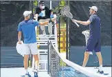  ?? AFP ?? Poland’s Hubert Hurkacz (left) and USA’S Reilly Opelka tapped racquets after their UTR Pro Match Series game held in Florida.