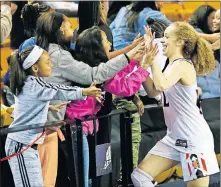  ?? [NATE BILLINGS/ THE OKLAHOMAN] ?? Norman's Mikayla Parks celebrates with fans after a 55-48 win over Edmond Santa Fe in the Class 6A semifinals Friday at the Mabee Center in Tulsa.