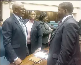  ?? ?? Ministry of Health Principal Secretary/Controllin­g Officer Khanyakwez­we Mabuza (L) and Auditor General Timothy Matsebula (R) in discussion­s after the PAC sitting was adjourned yesterday.