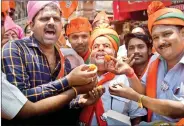  ??  ?? BJP supporters celebrate their win in Varanasi in 2014.