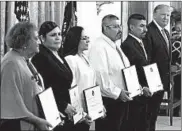  ?? ALEX BRANDON/AP ?? President Donald Trump, right, stands with five civilians receiving Heroic Commendati­ons on Monday for actions during the mass shooting last month in El Paso, Texas.