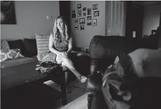  ?? Joe Amon, The Denver Post ?? Emily Griffith High School teacher Rebecka Hendricks couldn’t afford to live in Denver. Now she has a roommate to help cover the costs of her 1,000-square-foot condo in Lakewood. “I don’t want to live the rest of my life living paycheck to paycheck,” she says.