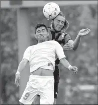  ?? Special to the NWA Democrat-Gazette/DAVID J. BEACH ?? Russellvil­le’s Landon Short (right) heads the ball over Ricardo Aguilar of Siloam Springs during Saturday’s Class 6A boys soccer championsh­ip game at Razorback Field in Fayettevil­le.