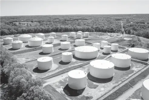  ?? DREW ANGERER/GETTY ?? Fuel holding tanks are seen Thursday at Colonial Pipeline’s Dorsey Junction Station in Washington, D.C.