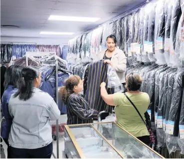  ?? PICTURE: HENK KRUGER/AFRICAN NEWS AGENCY/ANA ?? NEW TERM: As back-to-school fever sweeps across the country, Cape Town parents were seen shopping for school uniforms at School & Leisure in Rondebosch in preparatio­n for the first term of 2018 which starts tomorrow.