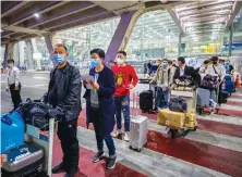  ?? AP ?? Chinese tourists arrive in Bangkok on special tourist visas, the first arrival since Thailand banned commercial flights almost seven months ago.