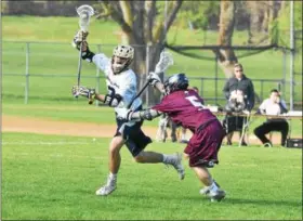  ?? BARRY TAGLIEBER - FOR DIGITAL FIRST MEDIA ?? Spring-Ford’s Ryan Rosenblum tries to get past Garnet Valley’s Ryan Louden during their meeting at the Katie Samson Festival Saturday at Radnor.