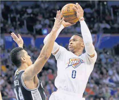  ??  ?? Oklahoma guard Russell Westbrook shoots in front of Spurs guard Danny Green.