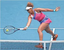  ?? HAMISH BLAIR/AP ?? Naomi Osaka plays a forehand return to Camila Osorio during their first-round Australian Open match on Monday in Melbourne.