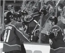  ?? Andy Cross, The Denver Post ?? Colorado’s Logan O’Connor, right, celebrates his first career NHL goal, with teammates Valeri Nichushkin, center, and Pierre-Edouard Bellemare.