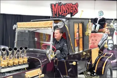  ?? The Sentinel-Record/Grace Brown ?? MUNSTER COACH: Butch Patrick, who portrayed Eddie Munster on the 1960s sitcom “The Munsters,” revs up the Munster Coach Sunday during the third annual Spa-Con at the Hot Springs Convention Center.