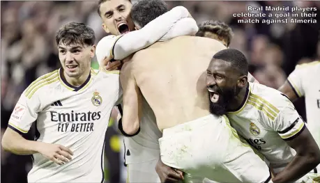  ?? ?? Real Madrid players celebrate a goal in their match against Almeria