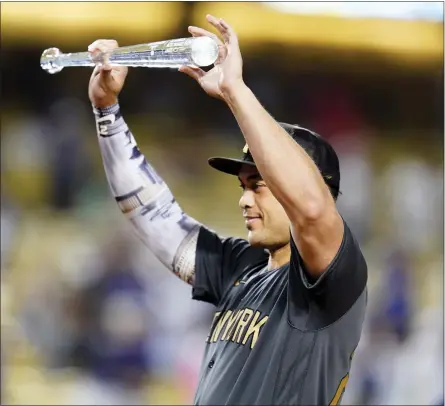  ?? AP PHOTO/ABBIE PARR ?? American League’s Giancarlo Stanton, of the New York Yankees, holds the MVP trophy at the end of the MLB All-Star baseball game against the National League, Tuesday, July 19, 2022, in Los Angeles.