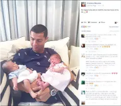  ??  ?? This picture obtained on Portugal football player Cristiano Ronaldo’s Facebook page on June 30, 2017 shows Ronaldo carrying his new born twin daughters. Ronaldo, 32, is believed to have fathered the twins with a surrogate mother in the United States....