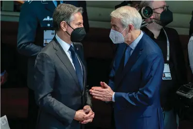  ?? The Associated Press ?? ■ Secretary of State Antony Blinken, left, speaks with Sen. Rob Portman, R-Ohio, right, before Vice President Kamala Harris speaks during the Munich Security Conference on Feb. 19 in Munich.