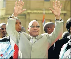  ??  ?? PLAYING TO CROWD: Jacob Zuma acknowledg­es his supporters outside the Johannesbu­rg High Court during his rape trial